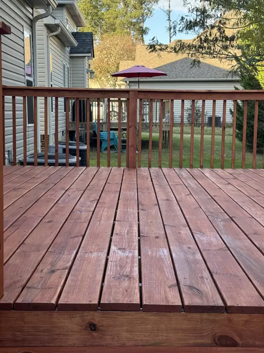 Close view of cedar-tone stained deck boards and railing in Chattanooga, TN