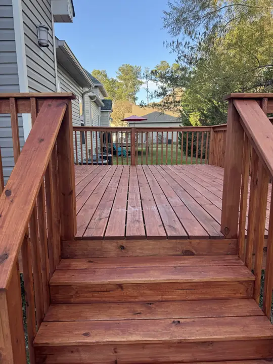 View up stained deck steps onto cedar-tone deck boards in Chattanooga, TN