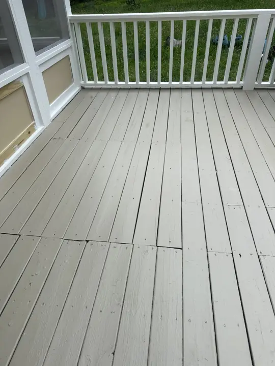 Screened porch floor boards painted soft greige with white railing in Signal Mountain, TN