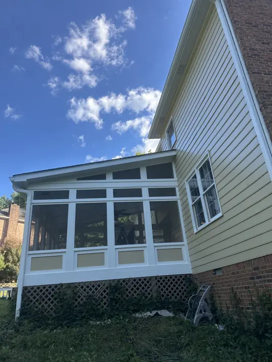 Screened porch side with white frame and tan panels beside tan siding in Signal Mountain, TN
