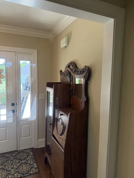 Front entry with painted walls, white crown molding and glass double doors in Hixson, TN