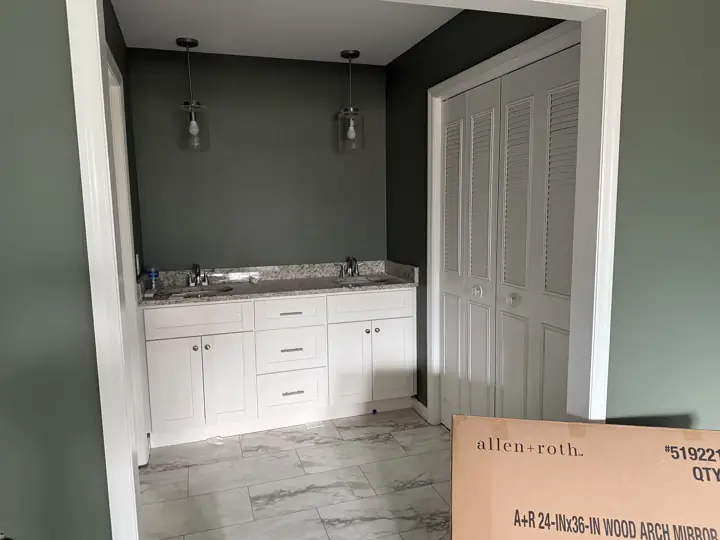 Vanity alcove with dark sage green walls and pendant lights in Hixson, TN