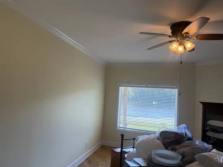 Cream bedroom walls with white crown molding and baseboards in Coalmont, TN