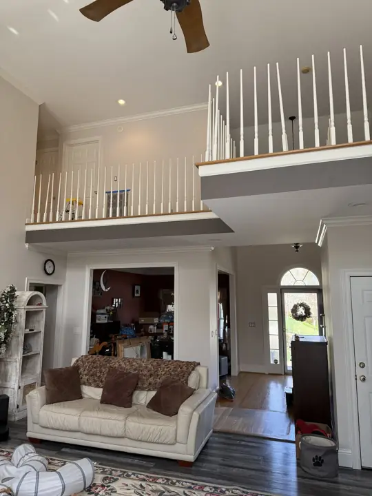 Loft balconies and foyer before the fascia and rails were painted in Hixson, TN