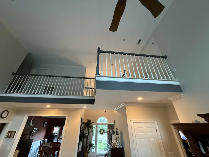 Two loft balconies with gray fascia above a light gray foyer in Hixson, TN