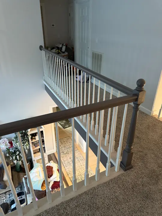 Upstairs loft railing painted gray with white spindles in Hixson, TN