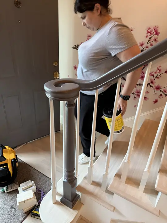 Stair handrail and newel post during painting in Hixson, TN