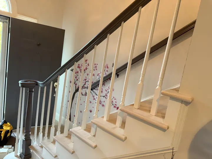 Side view of staircase with gray handrail and white balusters in Hixson, TN
