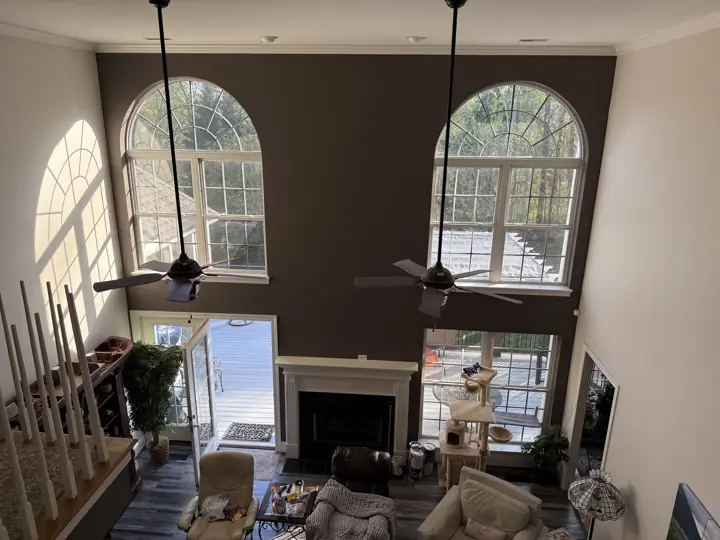 Overhead view of a two-story living room and fireplace wall in Hixson, TN