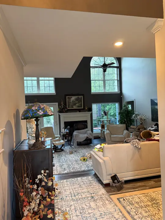 View into a living room with dark accent wall from the hallway in Hixson, TN