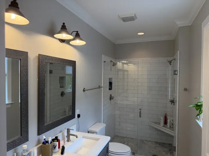 Light gray bathroom walls with white crown molding and subway-tile shower in Chattanooga, TN