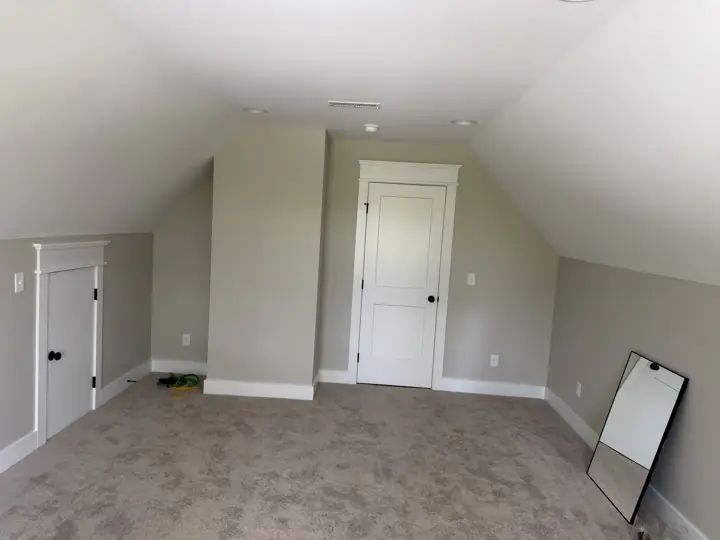 Bonus room with angled ceilings, small attic door and white two-panel door, Soddy-Daisy, TN