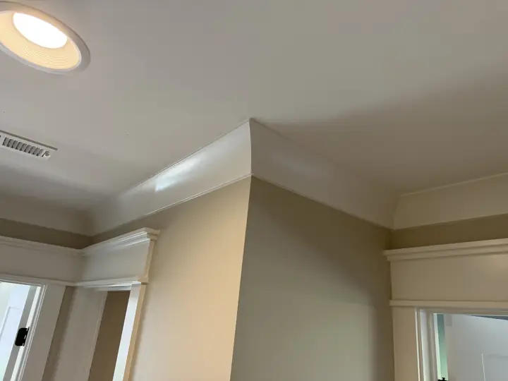 White crown molding and door headers on greige hallway walls, Soddy-Daisy, TN