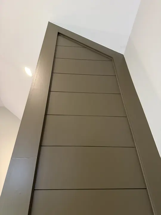 Olive shiplap chimney top meeting a sloped white ceiling, Soddy-Daisy, TN