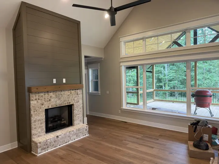 Living room with olive shiplap fireplace, greige walls and large white-trimmed windows, Soddy-Daisy, TN