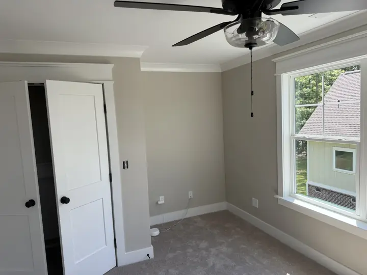 Greige bedroom with white closet doors, window casing and crown molding, Soddy-Daisy, TN