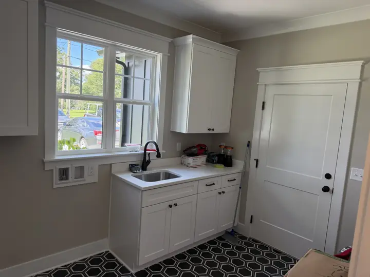 Laundry room with greige walls and white door and window trim, Soddy-Daisy, TN