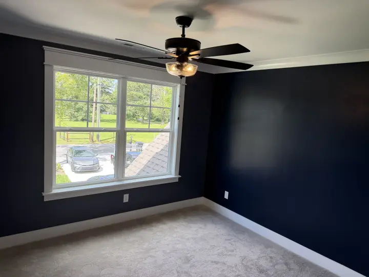 Navy blue bedroom walls with white window casing and baseboards, Soddy-Daisy, TN