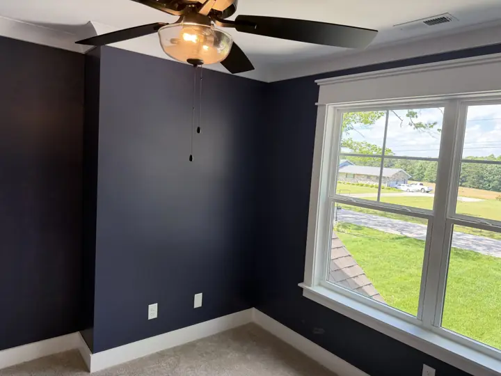 Navy bedroom walls with white window trim and crown molding, Soddy-Daisy, TN