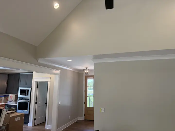Vaulted greige ceiling area and white trim opening to the kitchen and entry, Soddy-Daisy, TN