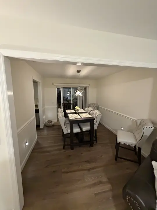 Dining room with warm white walls and white chair rail, Chattanooga, TN