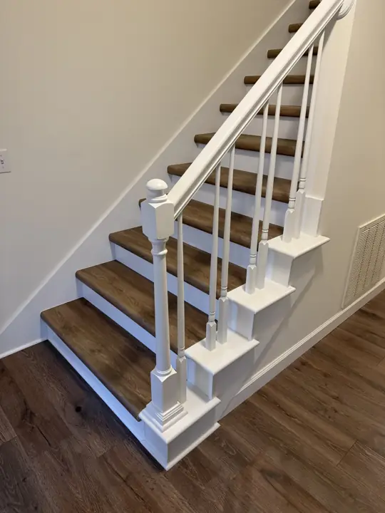 White painted stair railing, newel post and risers with wood-tone treads, Chattanooga, TN