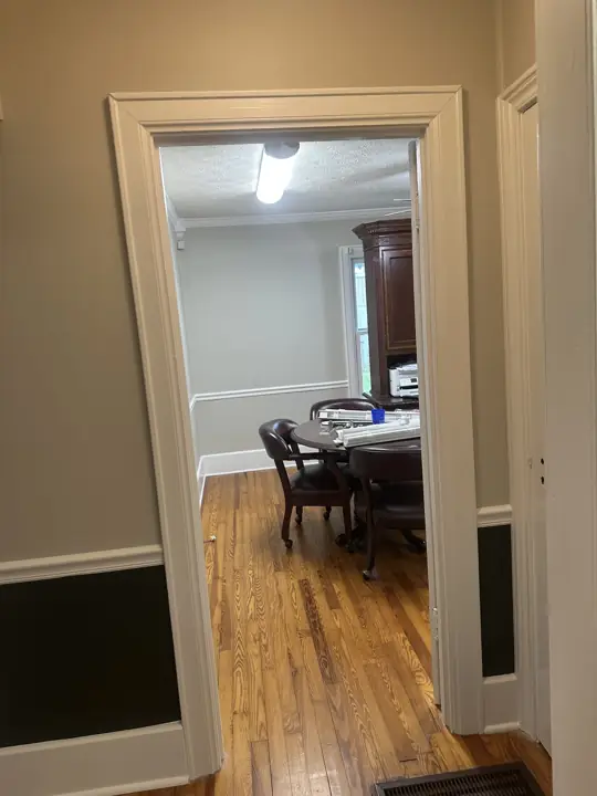 White cased doorway in a two-tone greige and near-black hallway in Ringgold, GA