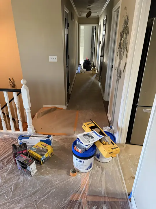 Hallway floors covered with paper and plastic before painting in Chattanooga, TN