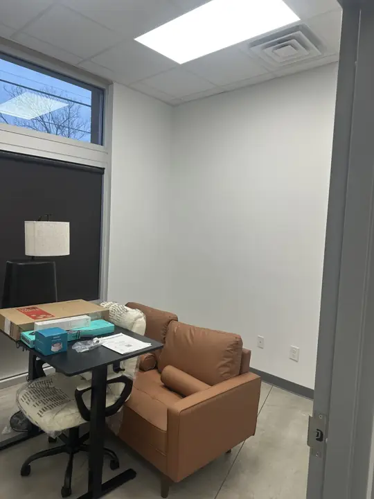 Small office with white walls and leather chair after interior painting in North Chattanooga, TN