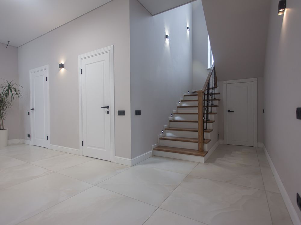 Foyer with staircase and tile flooring
