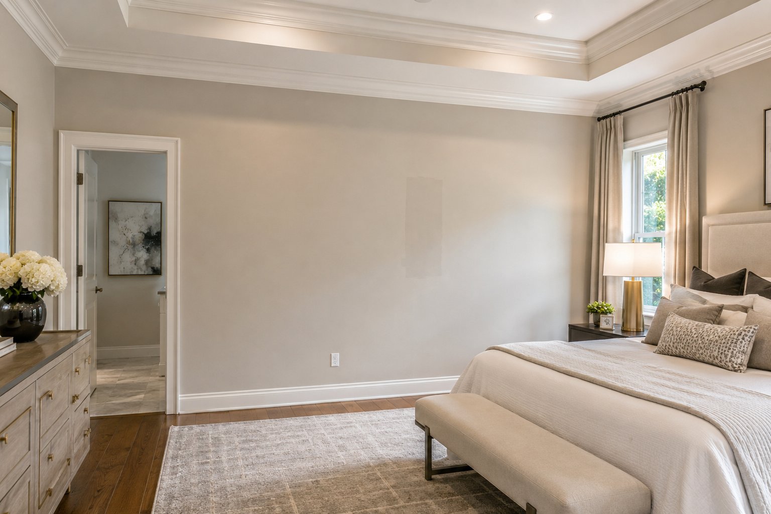 Chattanooga living room prepared for painting: furniture covered with drop cloth, painter's tape on baseboards