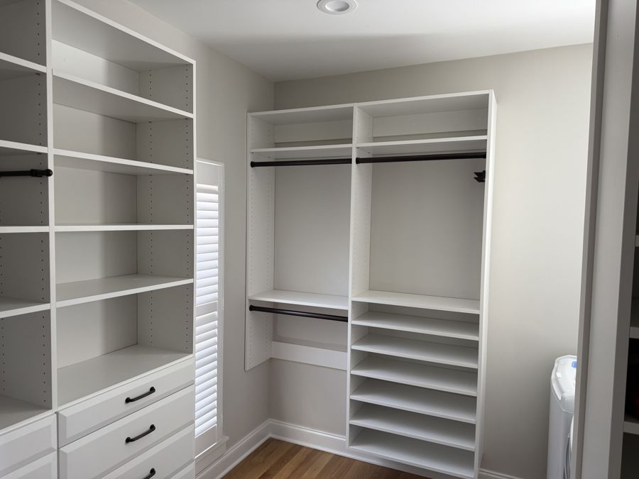 Painted white closet shelving, hanging rods and drawer bank in Harrison, TN