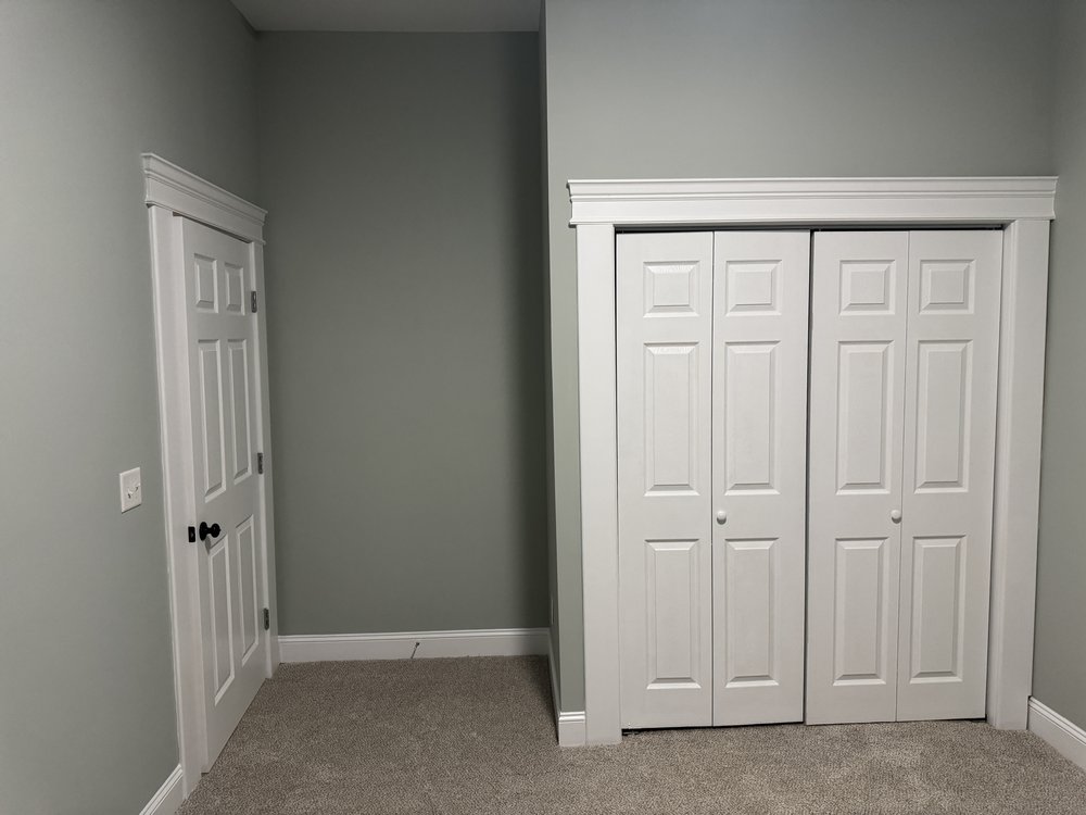 Living space repaint with clean wall-to-ceiling lines